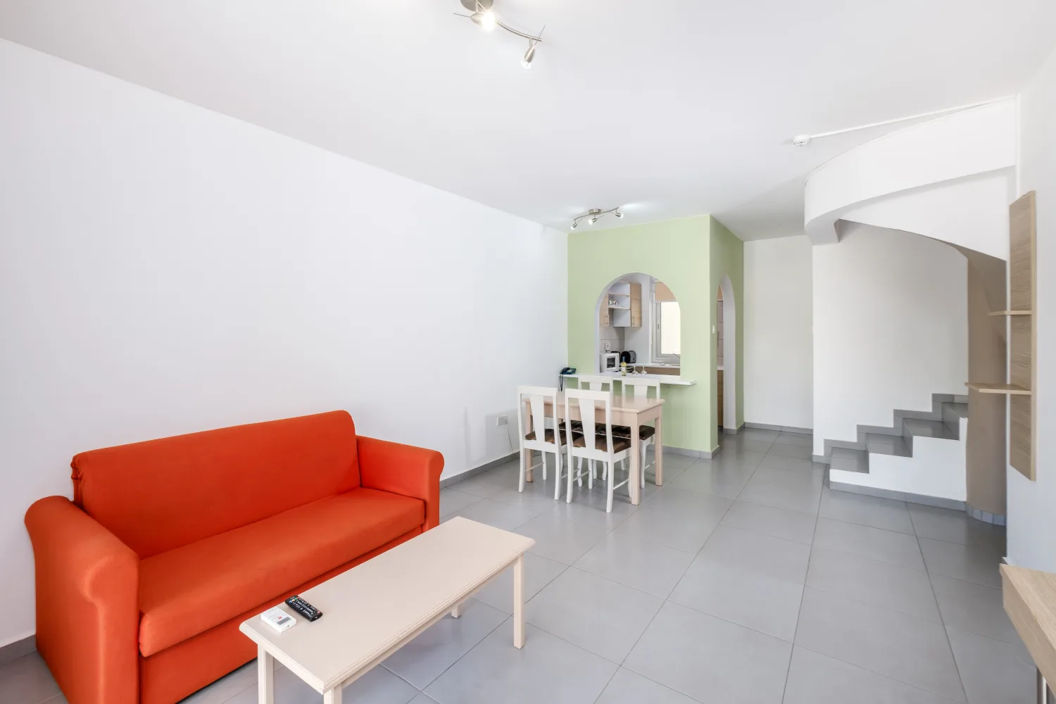 Deluxe one bedroom apartment with a living area and dining table